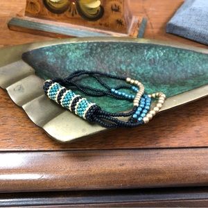 Handmade black blue and gold beaded bracelet